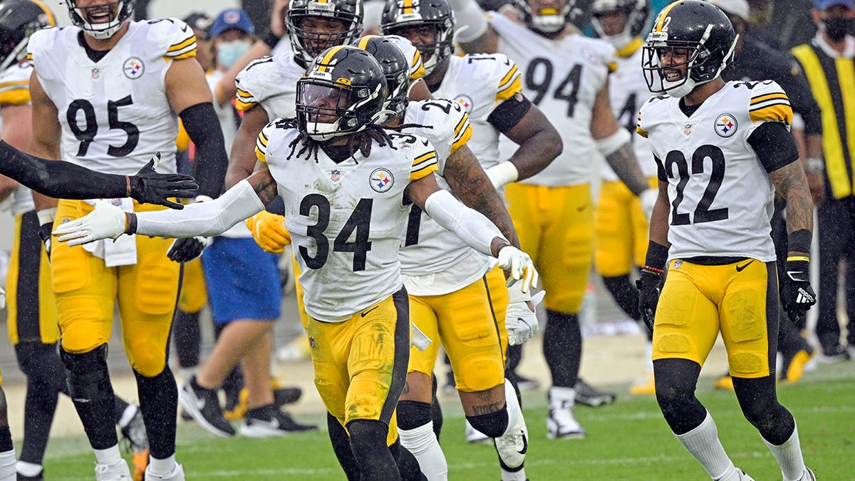 Pittsburgh Steelers safety Terrell Edmunds (34) celebrates with teammates after he intercepted a Jacksonville Jaguars pass during the second half of an NFL football game, Sunday, Nov. 22, 2020, in Jacksonville, Fla. (AP Photo/Phelan M. Ebenhack)