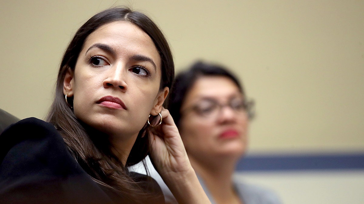 Rep. Alexandria Ocasio-Cortez (L) (D-NY) and Rep. Rashida Tlaib (D-MI) listen to testimony from acting Homeland Security Secretary Kevin McAleenan while he testifies before the House Oversight and Reform Committee in Washington, DC. The hearing is on "The Trump Administration's Child Separation Policy." (Photo by Win McNamee/Getty Images)