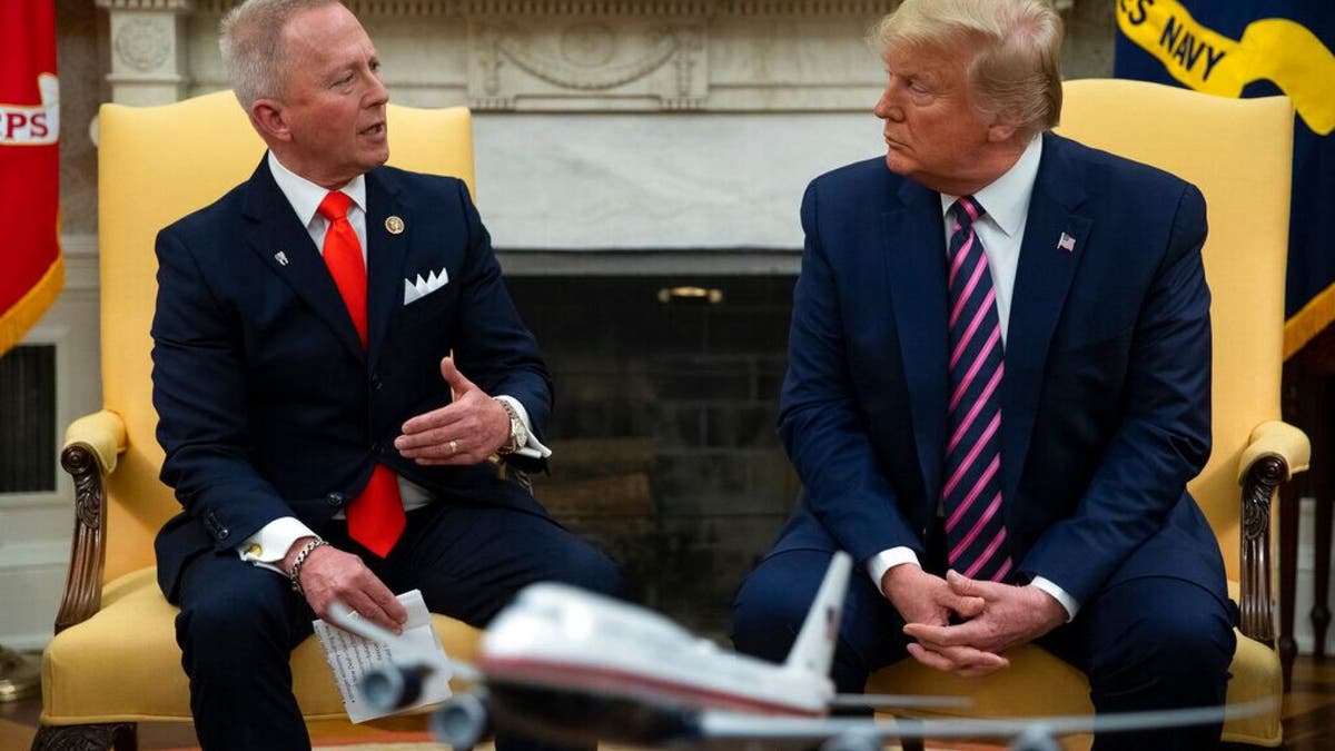 President Donald Trump meets with Rep. Jeff Van Drew, D-N.J., who is planning to switch his party affiliation, in the Oval Office of the White House, Thursday, Dec. 19, 2019, in Washington. (AP Photo/ Evan Vucci)