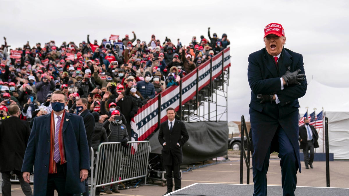 President Donald Trump arrives Oakland County International Airport, Sunday, Nov. 1, 2020, in Waterford Township, Mich. (AP Photo/Evan Vucci)