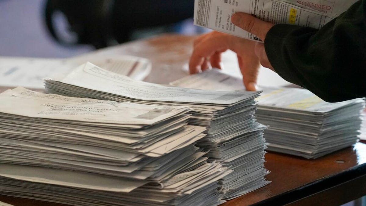 Workers count Milwaukee County ballots on Election Day at Central Count on Tuesday, Nov. 3, 2020, in Milwaukee. (AP Photo/Morry Gash)