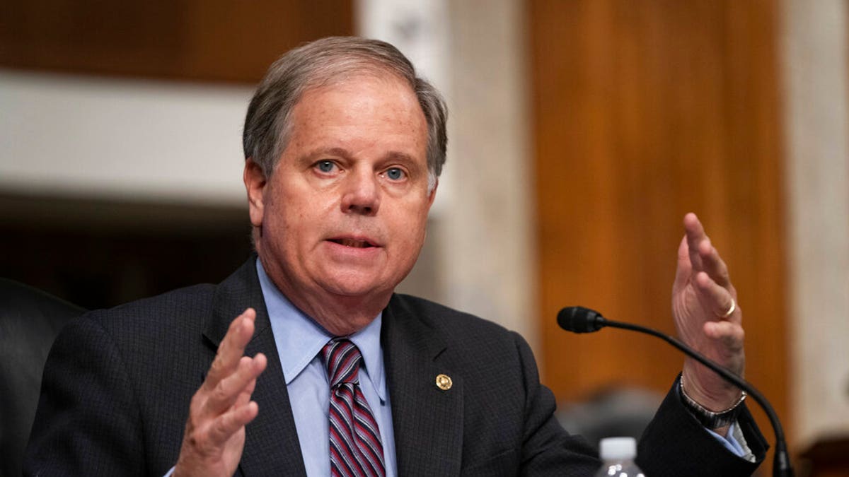 FILE - In this Sept. 23, 2020, file photo, Sen. Doug Jones, D-Ala., questions witnesses during a Senate Health, Education, Labor, and Pensions Committee Hearing on the federal government response to COVID-19 on Capitol Hill. (Alex Edelman/Pool via AP, File)