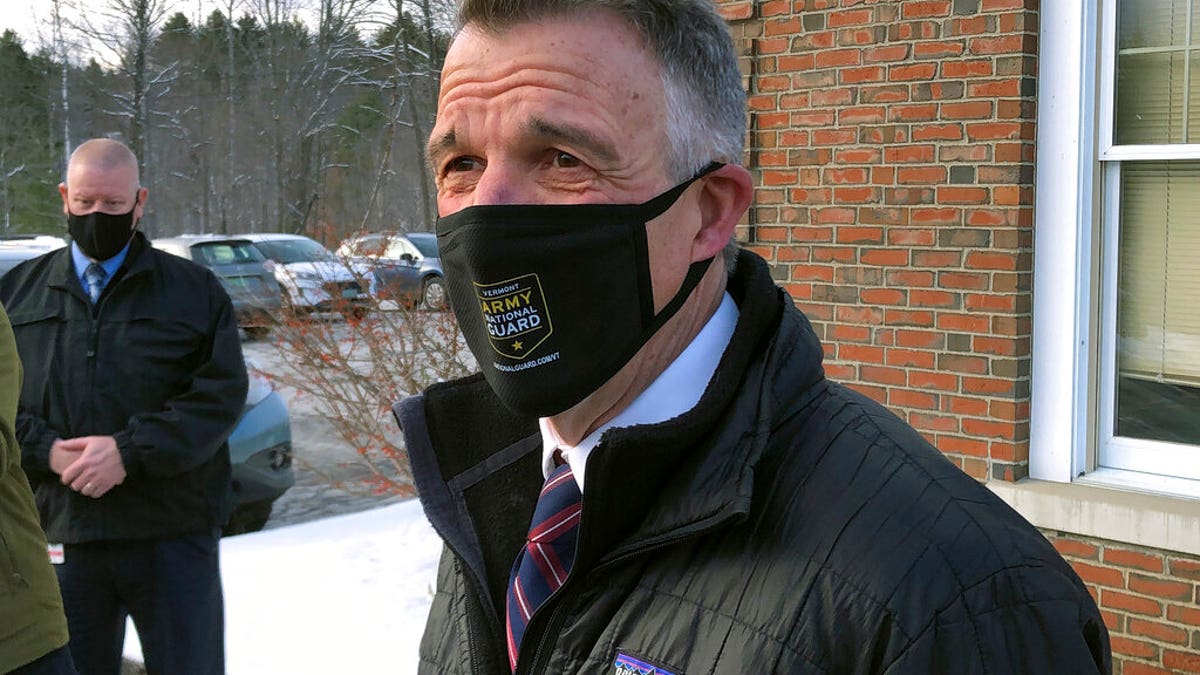 Vermont Republican Gov. Phil Scott speaks to reporters after voting on Tuesday, Nov. 3, 2020, in his hometown of Berlin, Vt.? (AP Photo/Wilson Ring)