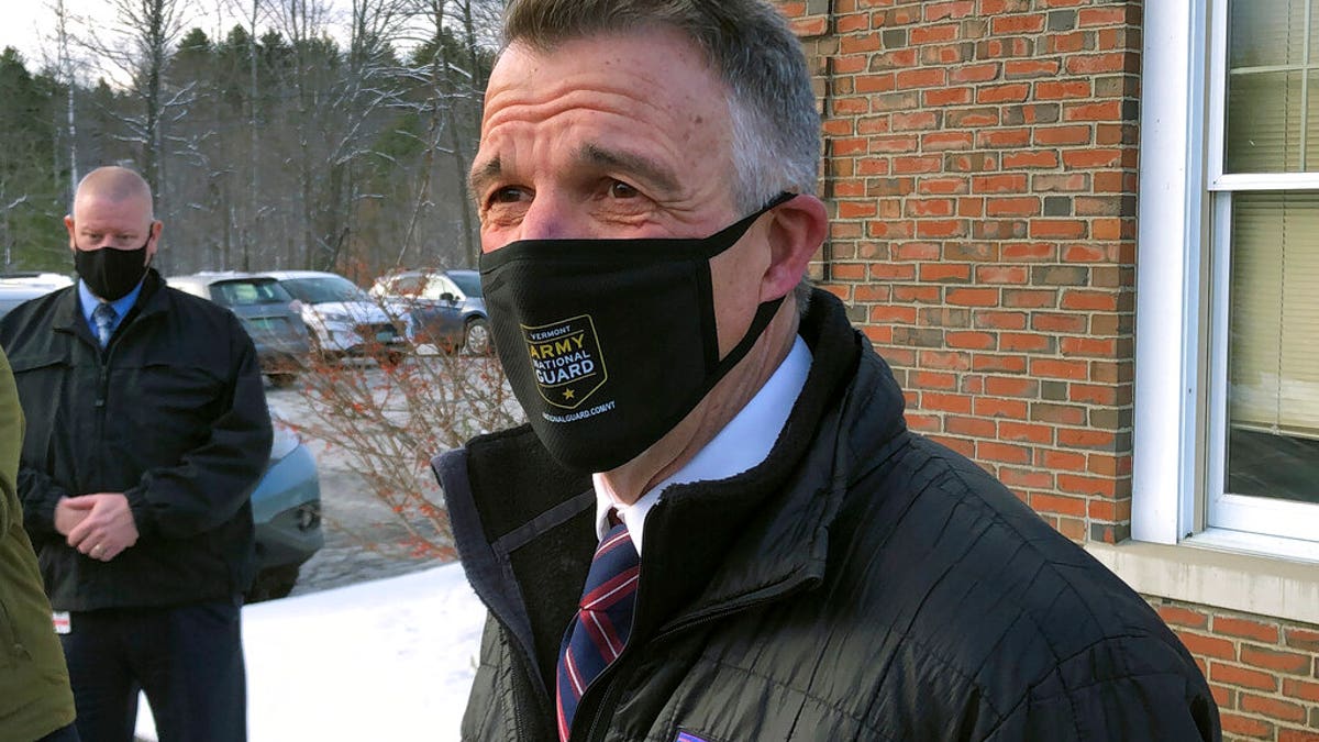 Vermont Republican Gov. Phil Scott speaks to reporters after voting on Tuesday, Nov. 3, 2020, in his hometown of Berlin, Vt. (AP Photo/Wilson Ring)