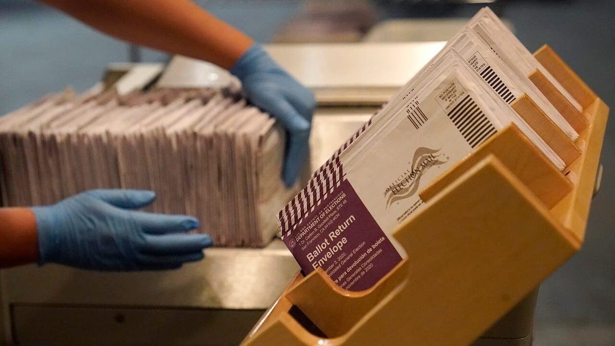 In this Nov. 1, 2020, file photo, envelopes containing ballots are shown at a San Francisco voting center. (AP Photo/Jeff Chiu, File)