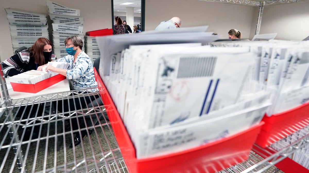 Lehigh County workers count ballots as vote counting in the general election continues, Thursday, Nov. 5, 2020, in Allentown, Pa. (AP Photo/Mary Altaffer)