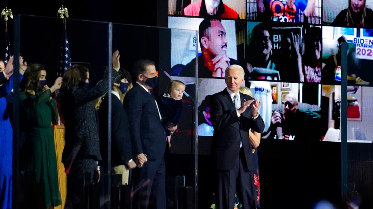 President-elect Joe Biden stands with his family after speaking in Wilmington, Del., Nov. 7. (AP Photo/Paul Sancya)