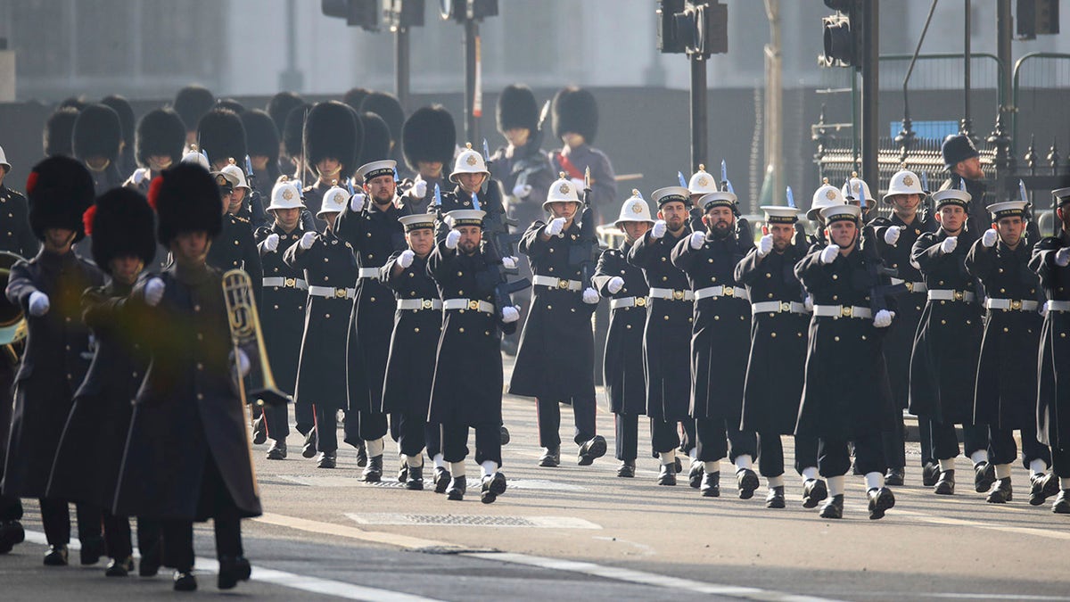 Members of the Royal Navy march, ahead of the Remembrance Sunday service at the Cenotaph, in Whitehall, London, Sunday Nov. 8, 2020. (Aaron Chown, Pool Photo via AP)