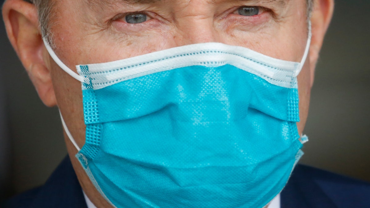 Utah Gov. Gary Herbert wears a mask during a news conference, in Salt Lake City on April 15, 2020. (AP Photo/Rick Bowmer, File)