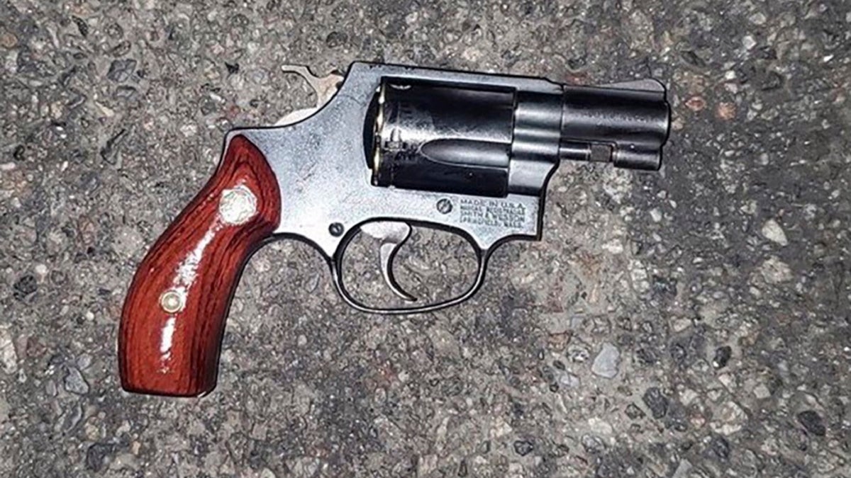 In this photo provided by the New York Police Department, a weapon lies on the pavement that police say was used in the attempted carjacking of an off-duty NYPD officer early on Nov. 11 in the Brooklyn. The city is grappling with a surge in violent crime and more brazen criminals following the shoving of two people onto subway train tracks in separate incidents that occurred hours apart this week. (NYPD via AP)