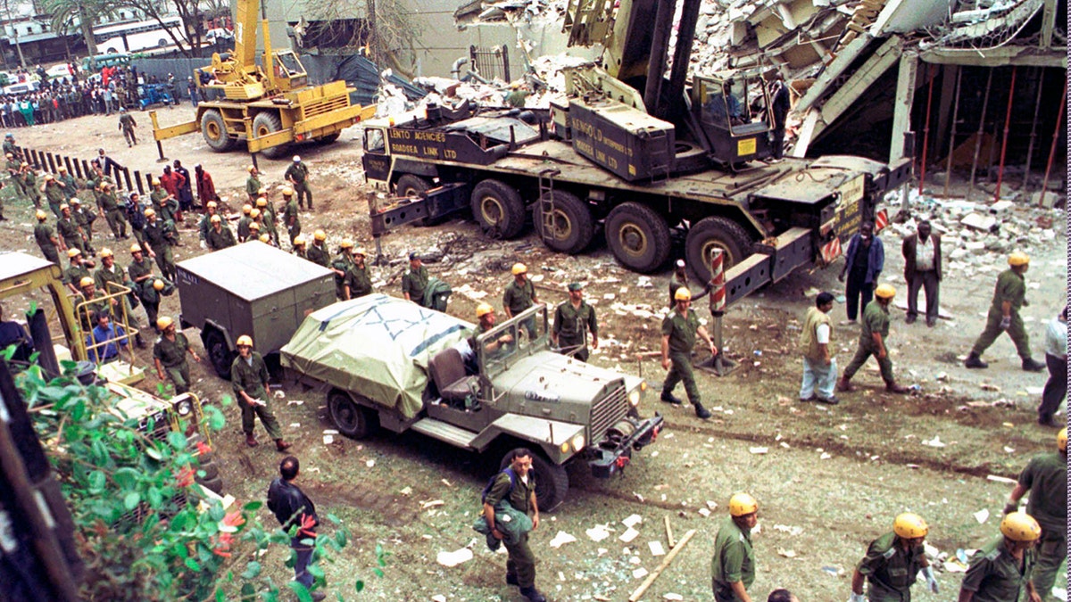 Israeli soldiers bring in heavy lifting equipment to the wreckage of the Ufundi House, adjacent to the U.S. Embassy in Nairobi on Aug. 9, 1998. The United States and Israel worked together to track and kill Abu Mohammed al-Masri, a senior Al Qaeda operative in Iran earlier this year, a bold intelligence operation by the two allied nations that came as the Trump administration was ramping up pressure on Tehran. (AP Photo/Sayyid Azim, File)