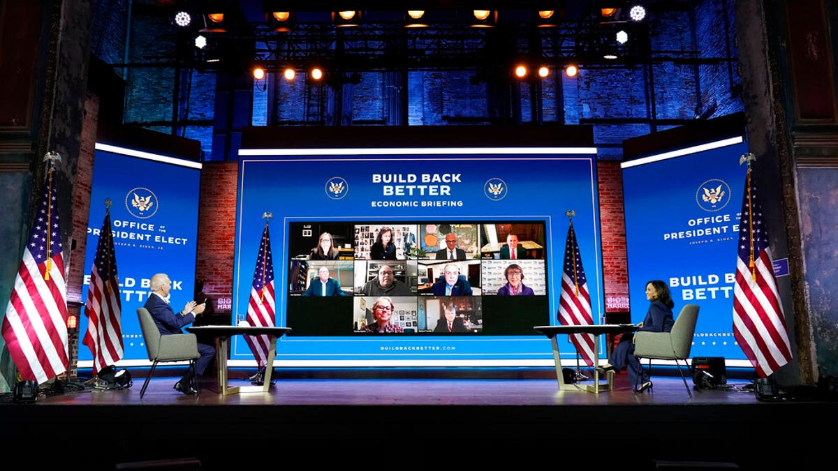 President-elect Joe Biden and Vice President-elect Kamala Harris attend a briefing on the economy at The Queen theater, Monday, Nov. 16, 2020, in Wilmington, Del. (AP Photo/Andrew Harnik)