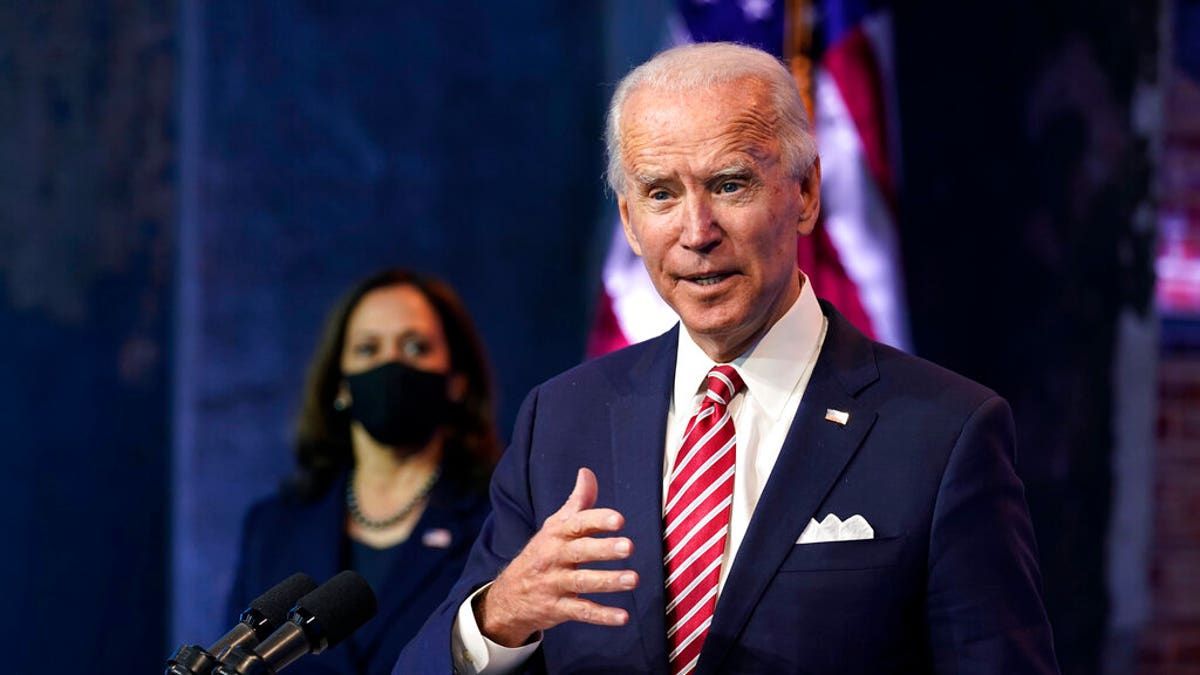 President-elect Joe Biden, accompanied by Vice President-elect Kamala Harris, speaks about economic recovery at The Queen theater, Monday, Nov. 16, 2020, in Wilmington, Del. (AP Photo/Andrew Harnik)