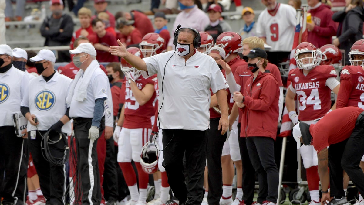 Arkansas head coach Sam Pittman, center, gestures on the sideline during the second half of an NCAA college football game against LSU, Saturday, Nov. 21, 2020, in Fayetteville, Ark.