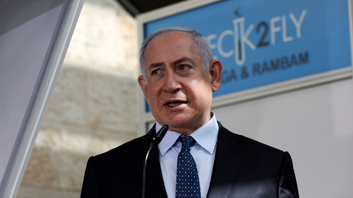 In this Nov. 9, 2020, file photo, Israeli Prime Minister Benjamin Netanyahu visits a new coronavirus lab at Ben-Gurion International Airport, near Tel Aviv, Israel. (Ohad Zwigenberg/Pool Photo via AP, File)