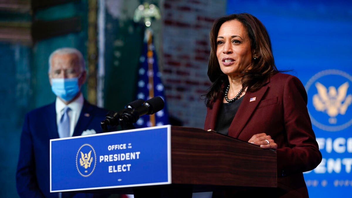 President-elect Joe Biden listens as Vice President-elect Kamala Harris speaks as they introduce their nominees and appointees to key national security and foreign policy posts at The Queen theater, Nov. 24, in Wilmington, Del. (AP Photo/Carolyn Kaster)