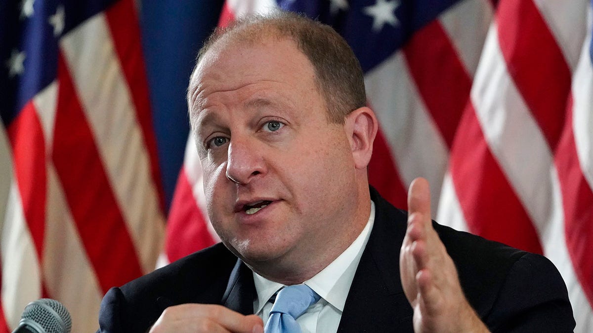 Colorado Gov. Jared Polis speaks during a news conference about the state's response to the rapid increase in COVID-19 cases, Tuesday, Nov. 24, 2020, in Denver. (AP Photo/David Zalubowski)