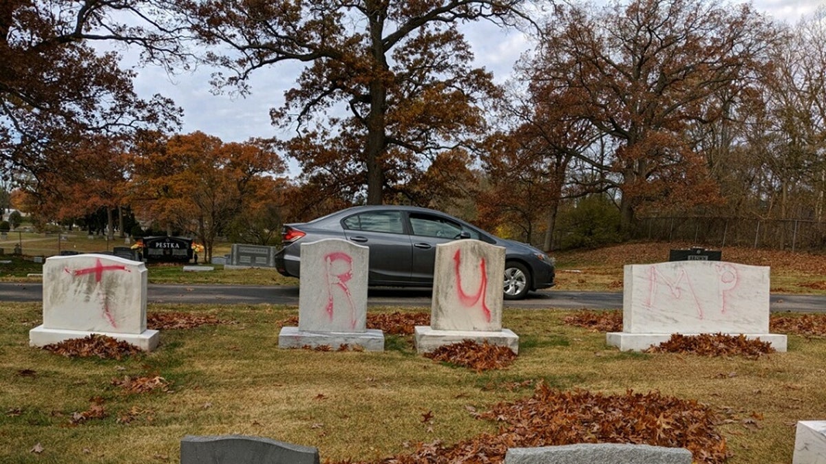 Headstones at the Congregation Ahavas Israel cemetery in Grand Rapids, Mich., were found vandalized Monday with pro-Trump slogans a day before the president is scheduled to appear at a rally in the city to close out his re-election campaign.