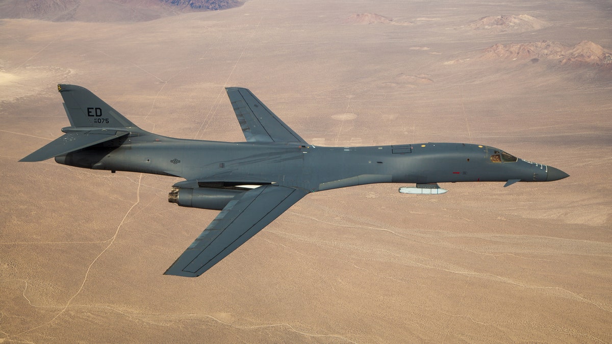 A B-1B Lancer with a Joint Air-to-Surface Standoff Missile (JASSM) flies in the skies above Edwards Air Force Base, California, Nov. 20, 2020.
