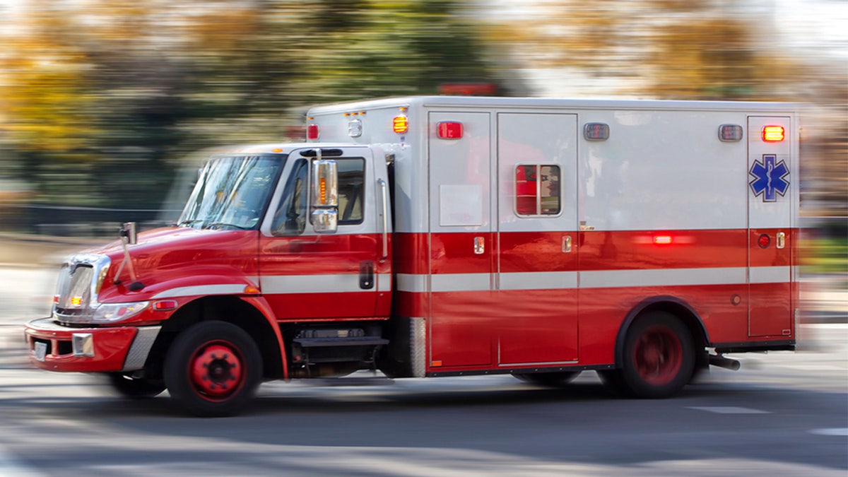 An ambulance on a city street.
