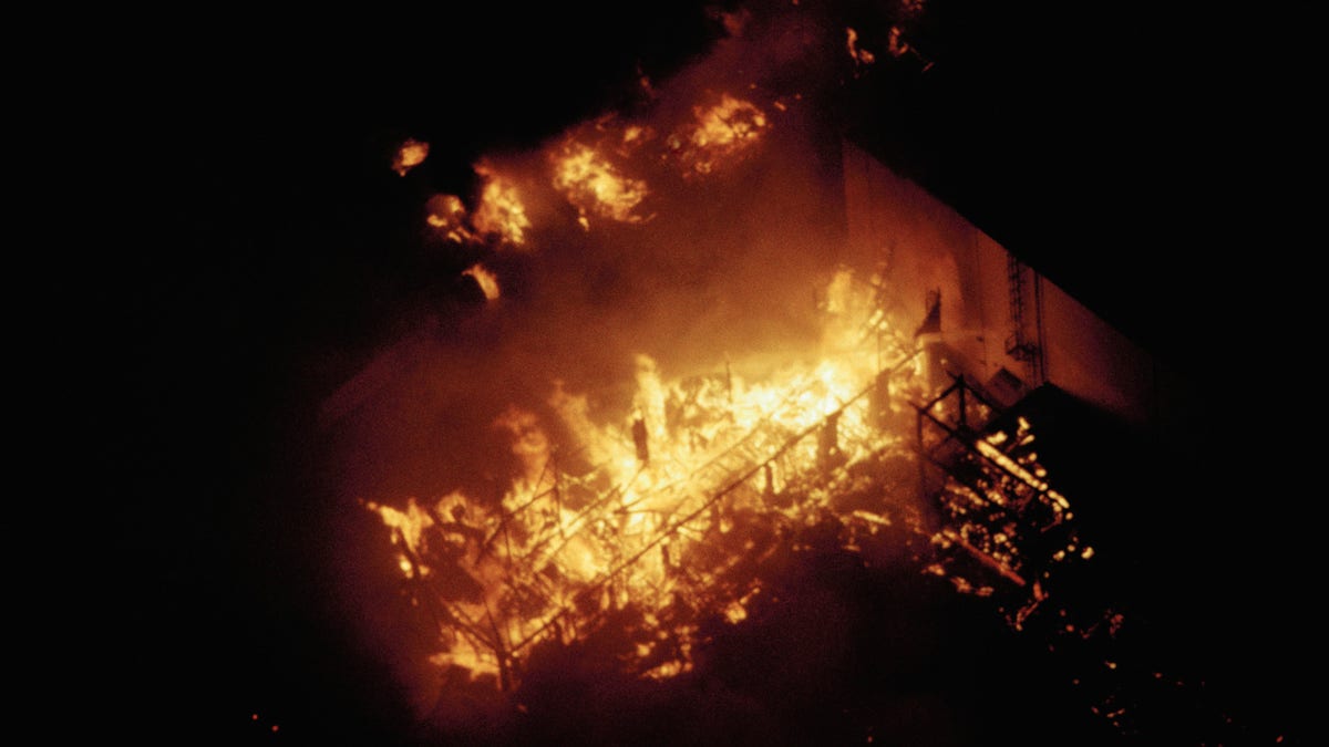 Structures in the back lot of Universal Studios burn in the Universal City section of Los Angeles on Nov. 6, 1990. (AP Photo/Reed Saxon)