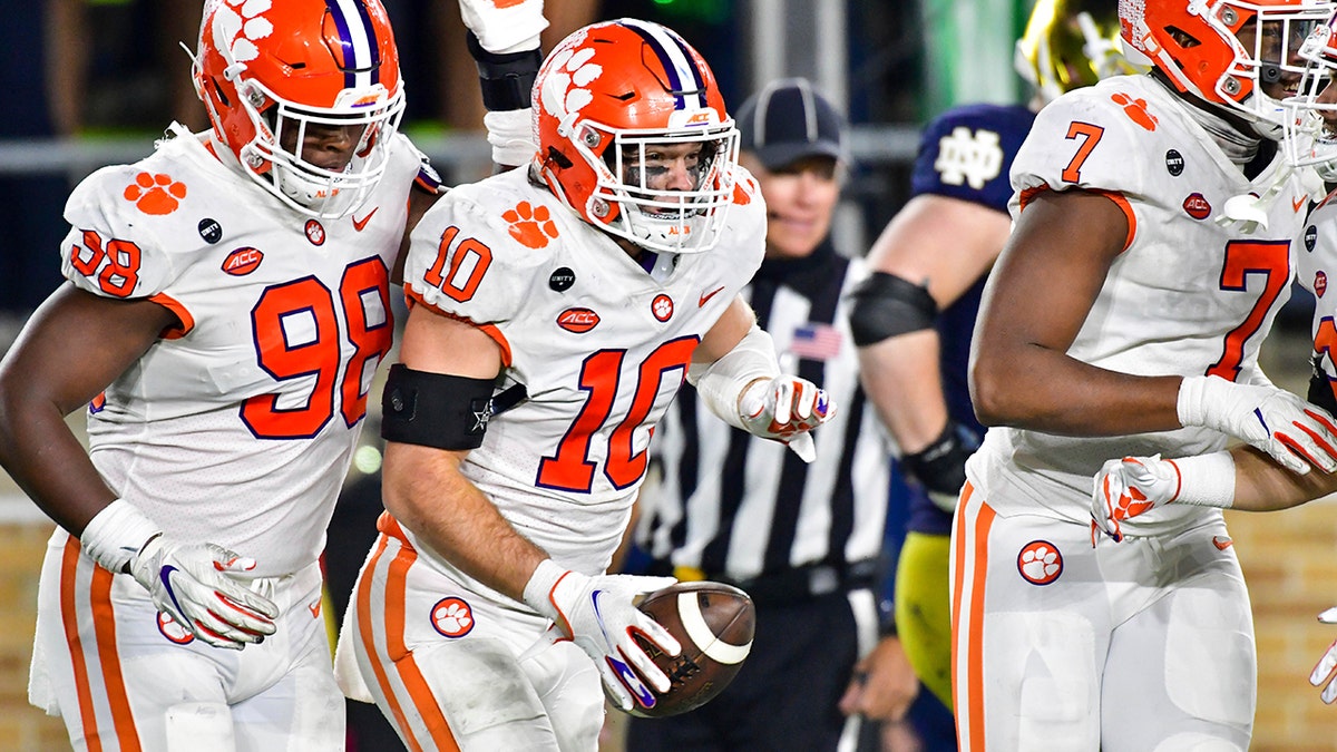 Clemson linebacker Baylon Spector (10) celebrates after recovering a Notre Dame fumble in the end zone during the third quarter of an NCAA college football game Saturday, Nov. 7, 2020, in South Bend, Ind. (Matt Cashore/Pool Photo via AP)