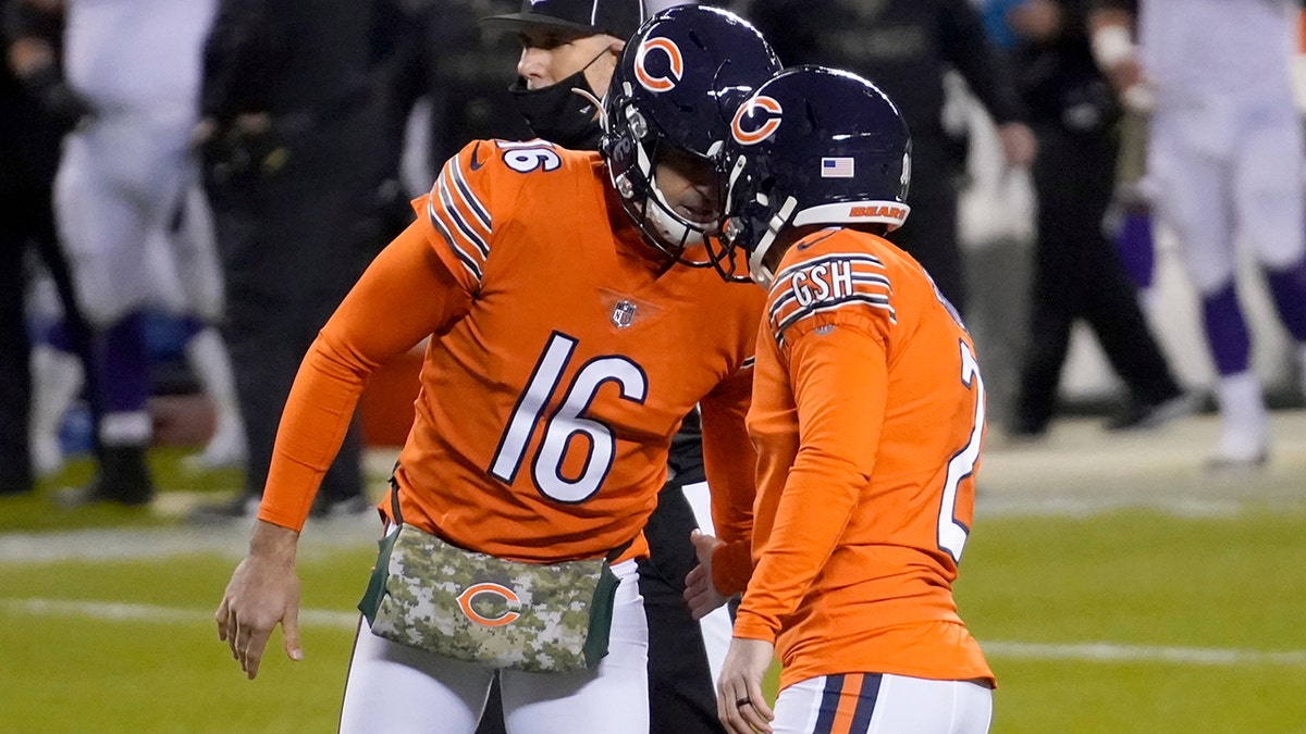 Chicago Bears place kicker Cairo Santos (2) is congratulated by teammate Pat O'Donnell (16) after kicking a 23-yard field goal during the first half of an NFL football game against the Minnesota Vikings Monday, Nov. 16, 2020, in Chicago. (AP Photo/Nam Y. Huh)