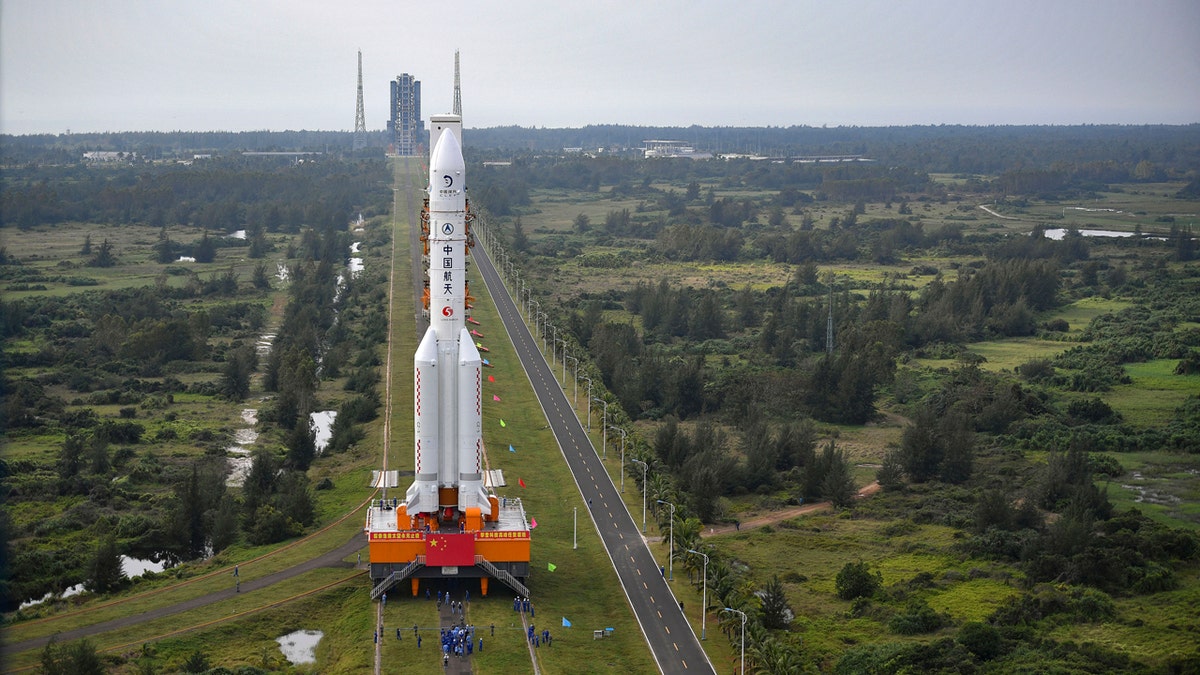 In this Nov. 17, 2020, photo released by China's Xinhua News Agency, a Long March-5 rocket is moved at the Wenchang Space Launch Site in Wenchang in southern China's Hainan Province.
