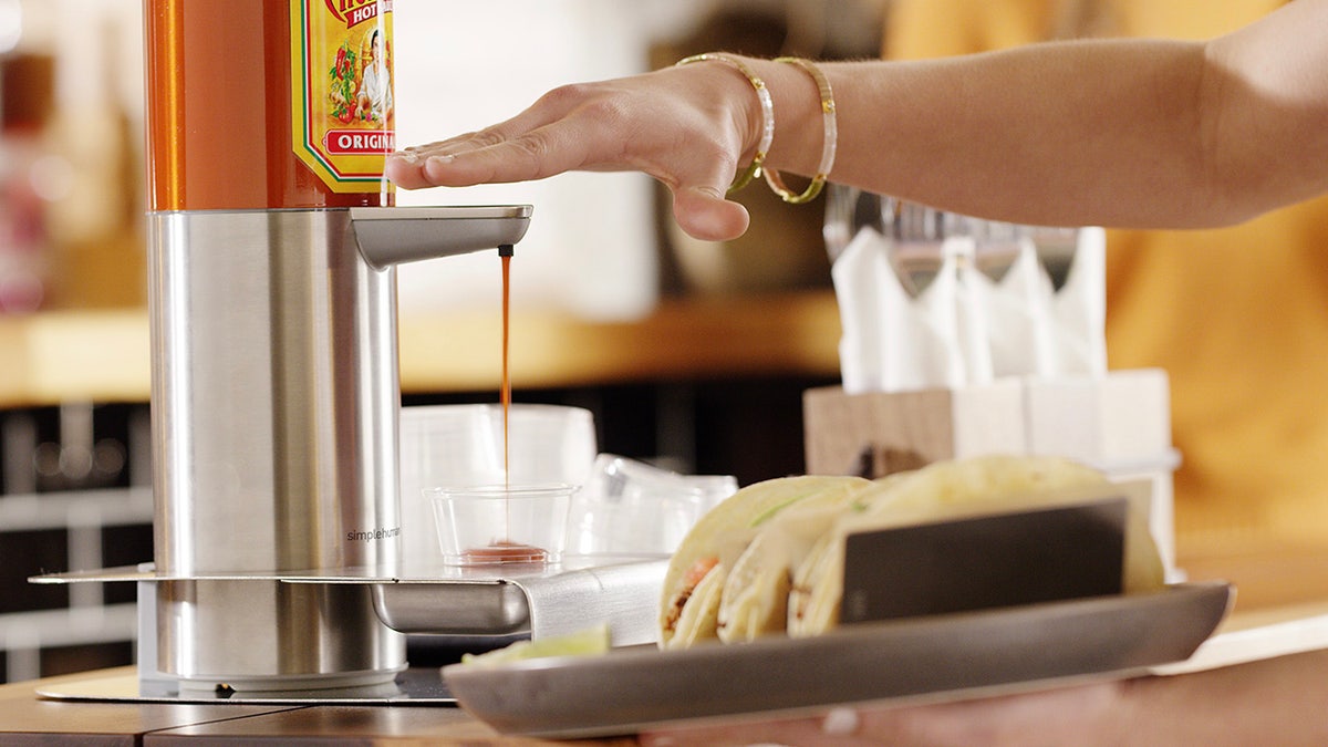 Cholula claims to have developed “the world’s first hands-free hot sauce dispenser.”