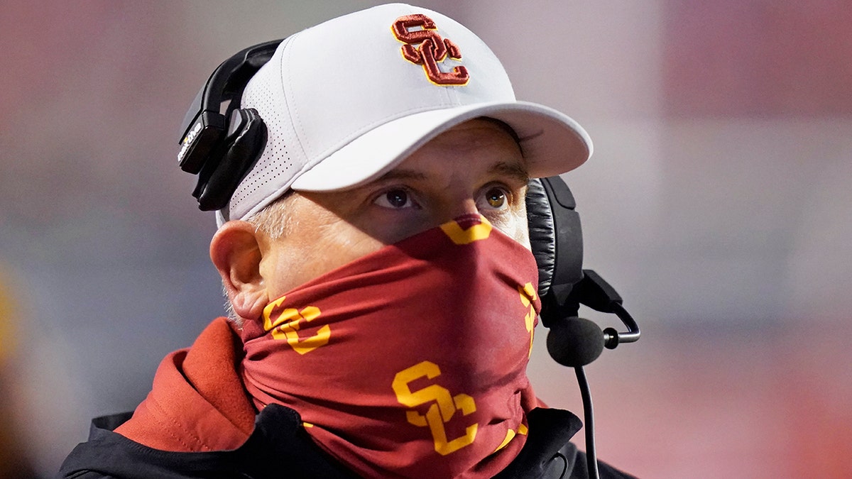 Southern California head coach Clay Helton looks on in the first half during an NCAA college football game against Utah, Saturday, Nov. 21, 2020, in Salt Lake City.
