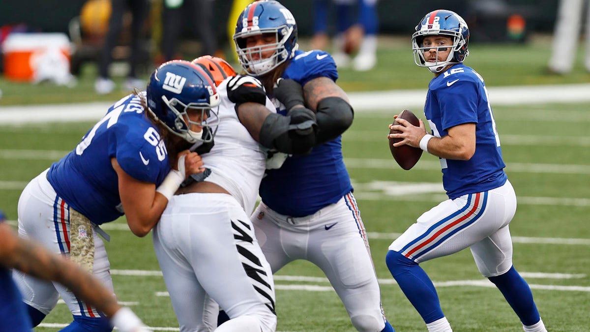 New York Giants quarterback Colt McCoy (12) looks to throw during the second half of an NFL football game against the Cincinnati Bengals, Sunday, Nov. 29, 2020, in Cincinnati. (AP Photo/Aaron Doster)