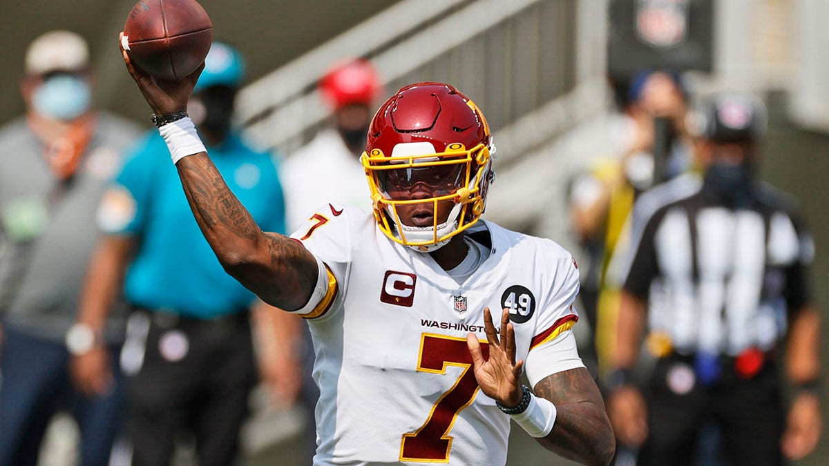 FILE - In this Sept. 27, 2020, file photo, Washington Football Team quarterback Dwayne Haskins throws during the first half of an NFL football game against the Cleveland Browns in Cleveland. (AP Photo/Ron Schwane, File)