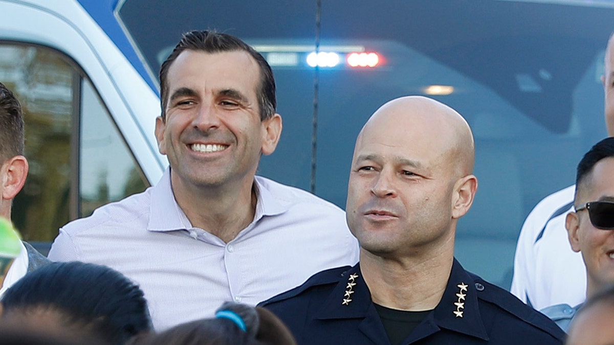 San Jose Police Department Police Chief Eddie Garcia, center right, and Mayor Sam Liccardo, center left, pose for picture. (Nhat V. Meyer/Digital First Media/The Mercury News via Getty Images)