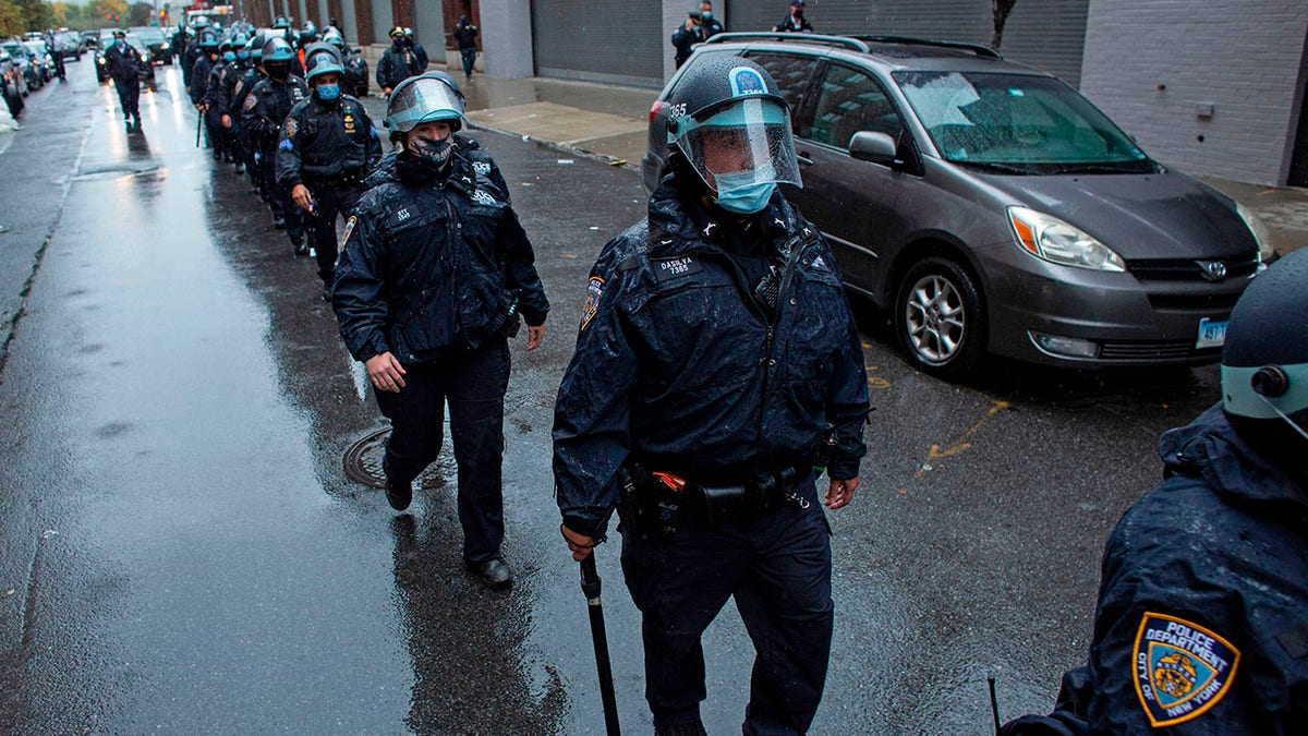New York Police Department officers patrol during a protest against the Far Right on November 1, 2020, in New York City. (KENA BETANCUR/AFP via Getty Images)