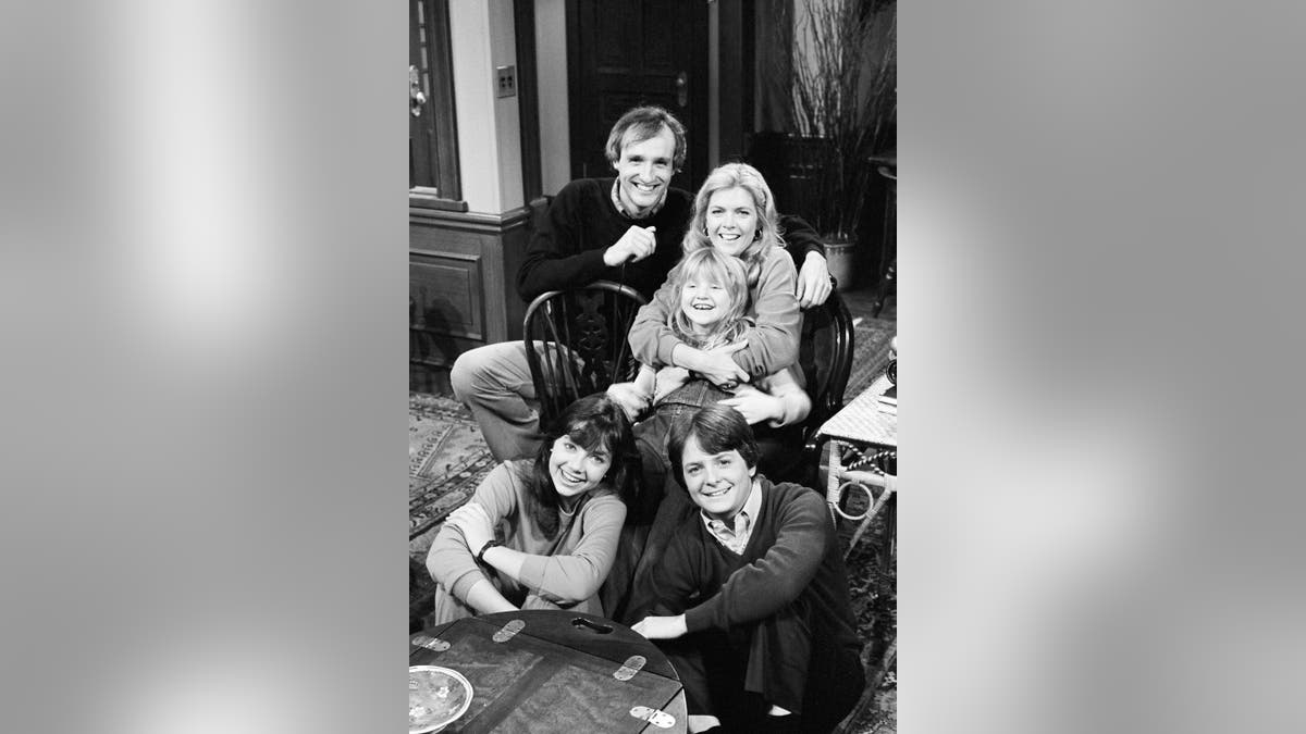 Pictured: (Front, l-r) Justine Bateman as Mallory Keaton, Michael J. Fox as Alex P. Keaton, (Back, l-r) Michael Gross as Steven Keaton, Meredith Baxter as Elyse Keaton, Tina Yothers as Jennifer Keaton in 'Family Ties.' (Photo by Paul Drinkwater/NBCU Photo Bank/NBCUniversal via Getty Images)