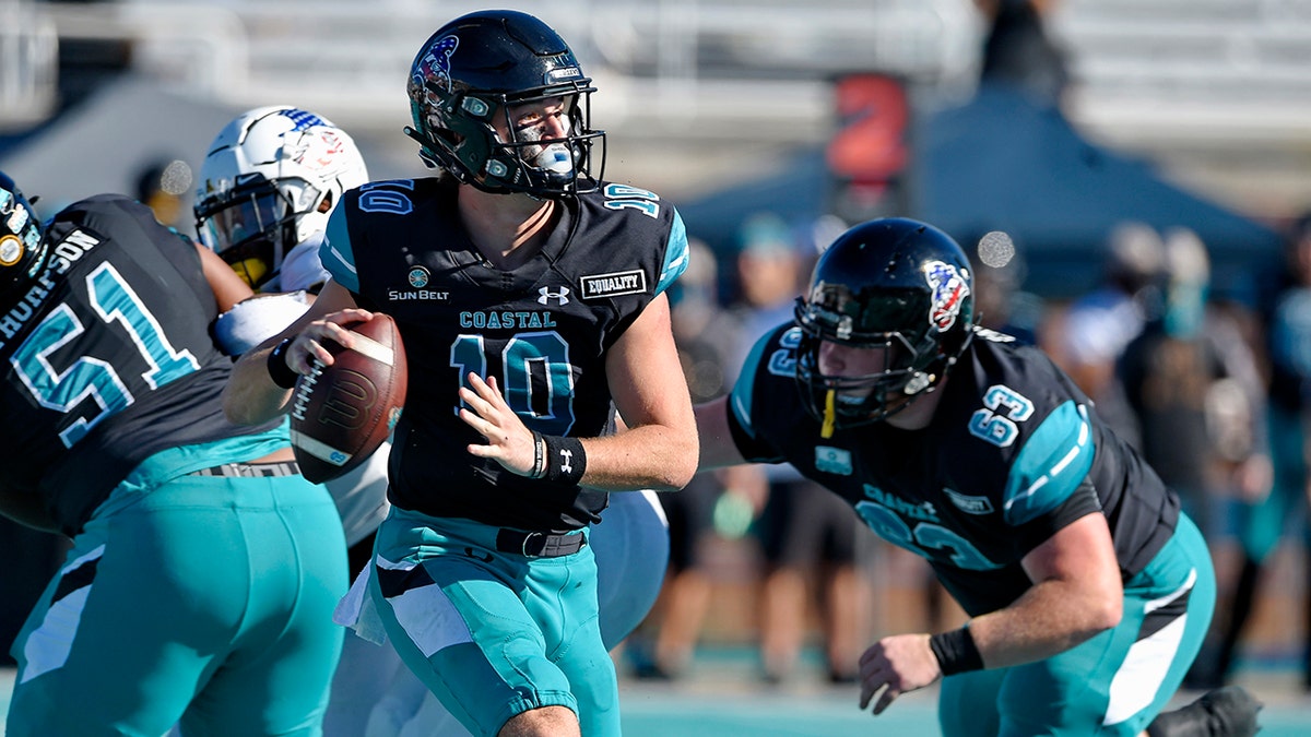 Coastal Carolina quarterback Grayson McCall (10) looks for a receiver during the first half of an NCAA college football game against Appalachian State, Nov. 21, in Conway, S.C. (AP Photo/Richard Shiro)
