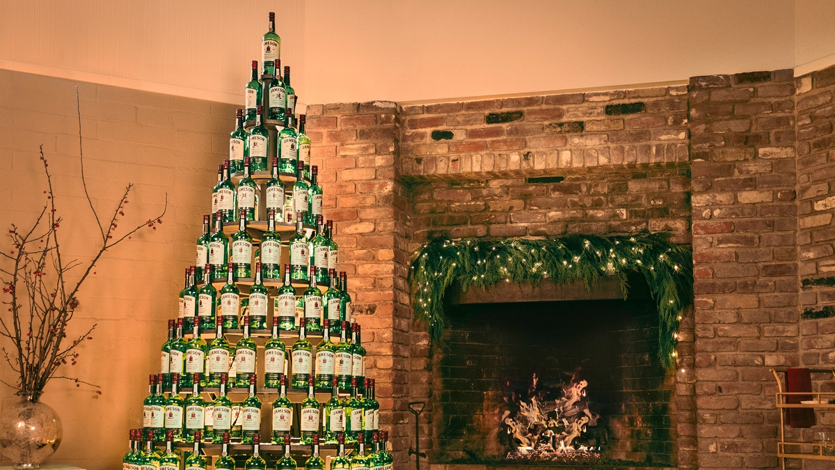 Jameson Irish Whiskey is giving away Christmas "trees" made with over 100 of its whiskey bottles and a unique lighting system. (Jameson)