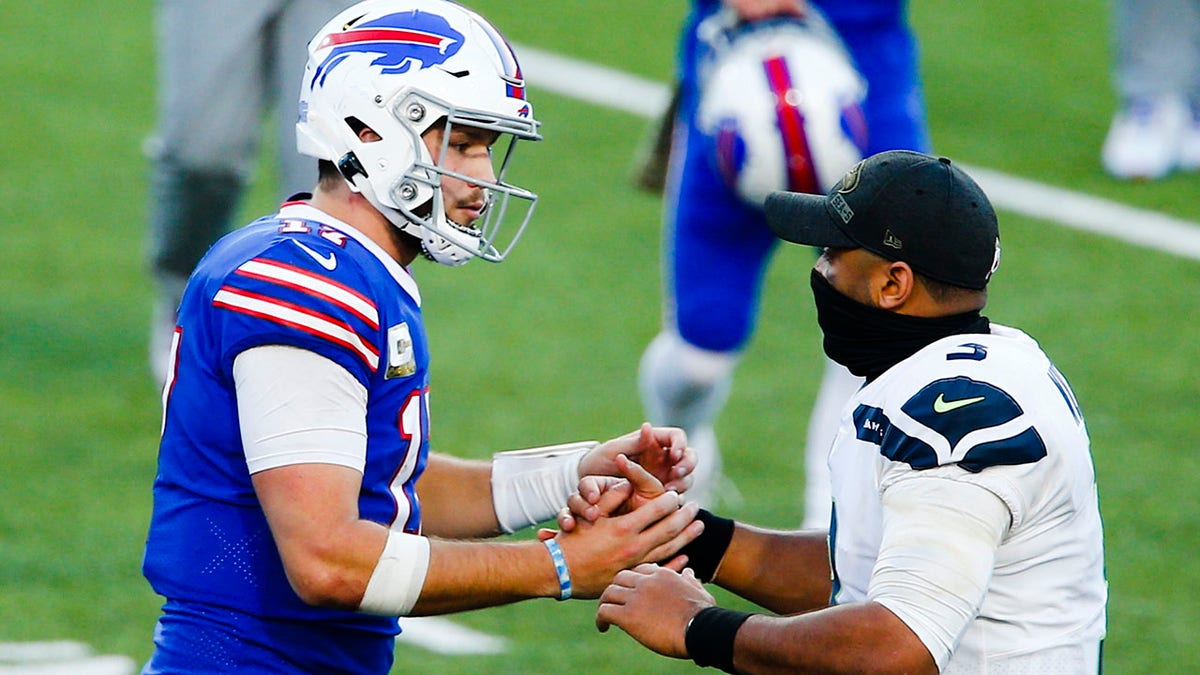 Buffalo Bills' Josh Allen, left, shakes hands with Seattle Seahawks' Russell Wilson after an NFL football game Sunday, Nov. 8, 2020, in Orchard Park, N.Y. (AP Photo/John Munson)