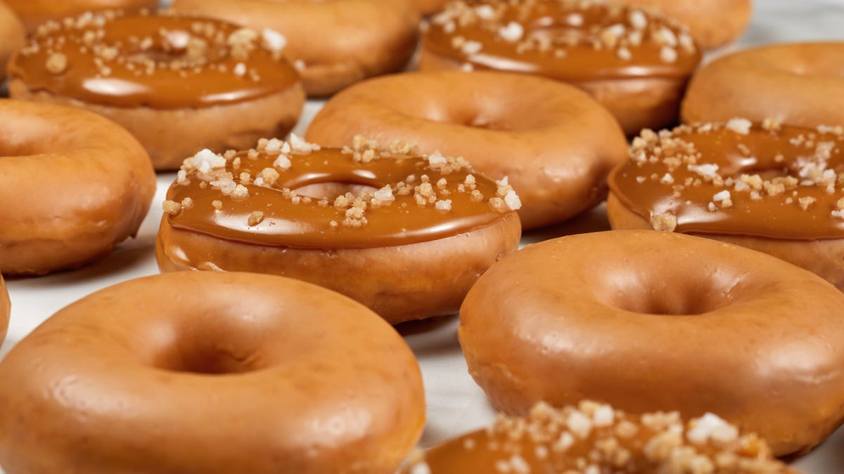 Krispy Kreme announced that it will be adding a caramel-flavored glazed doughnut and a salted double caramel crunch doughnut to its lineup.