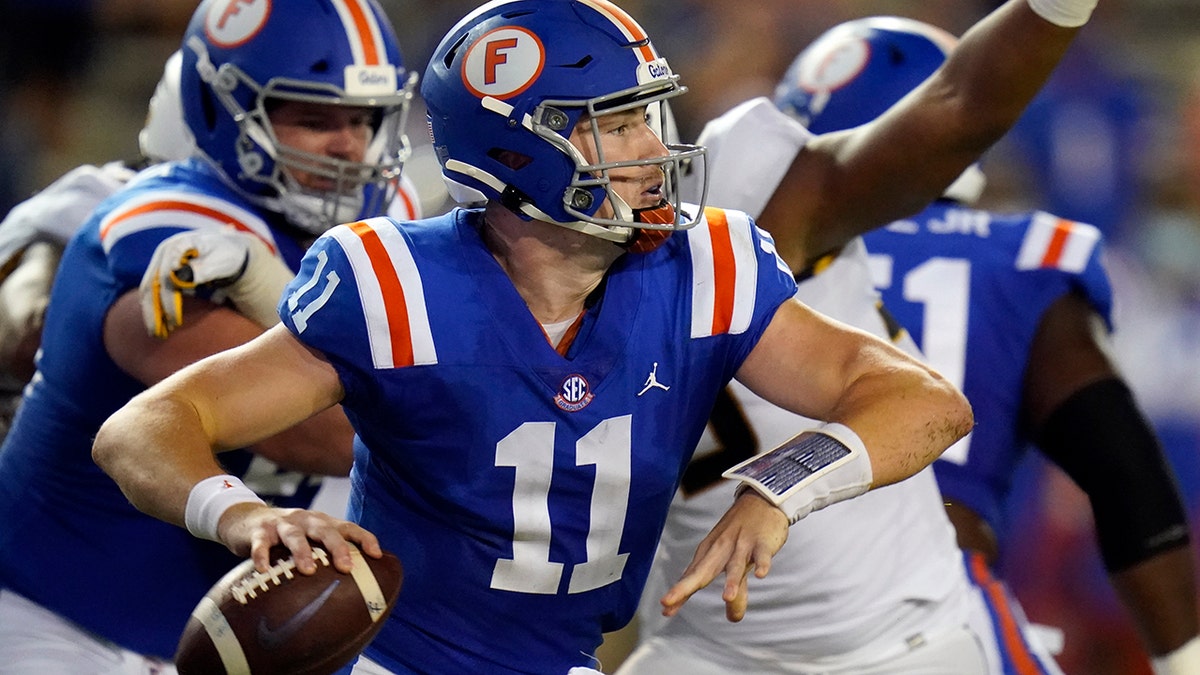 Florida quarterback Kyle Trask looks for a receiver during the first half of an NCAA college football game against Missouri, Saturday, Oct. 31, 2020, in Gainesville, Fla. (AP Photo/John Raoux)