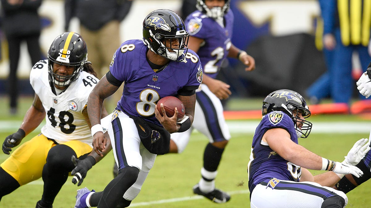 Baltimore Ravens quarterback Lamar Jackson (8) scrambles against the Pittsburgh Steelers during the first half of an NFL football game, Sunday, Nov. 1, 2020, in Baltimore.
