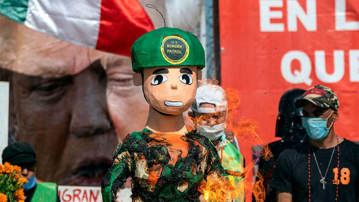 Protesters also burned a piñata depicting a U.S. border patrol agent.