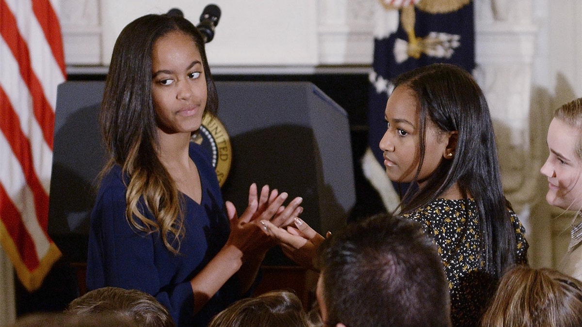 Former first lady Michelle Obama said that her daughters, Sasha and Malia, 26 and 23, are trying to make their own path and differentiate themselves from their famous parents. (Photo by Olivier Douliery-Pool/Getty Images)
