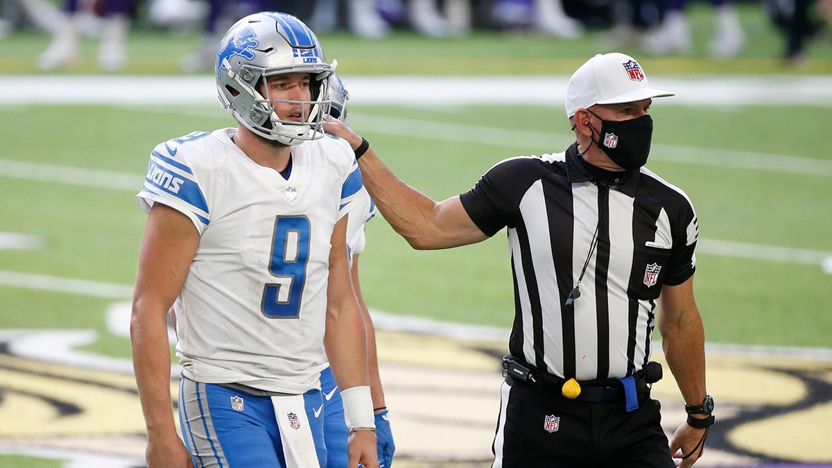Detroit Lions quarterback Matthew Stafford (9) is helped off the field after getting injured during the second half of an NFL football game against the Minnesota Vikings, Sunday, Nov. 8, 2020, in Minneapolis. (AP Photo/Bruce Kluckhohn)