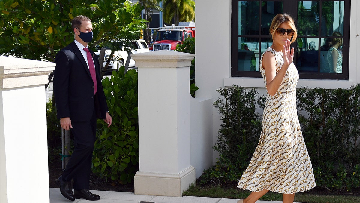 Melania Trump wears a red cape dress for dinner with Prince Charles
