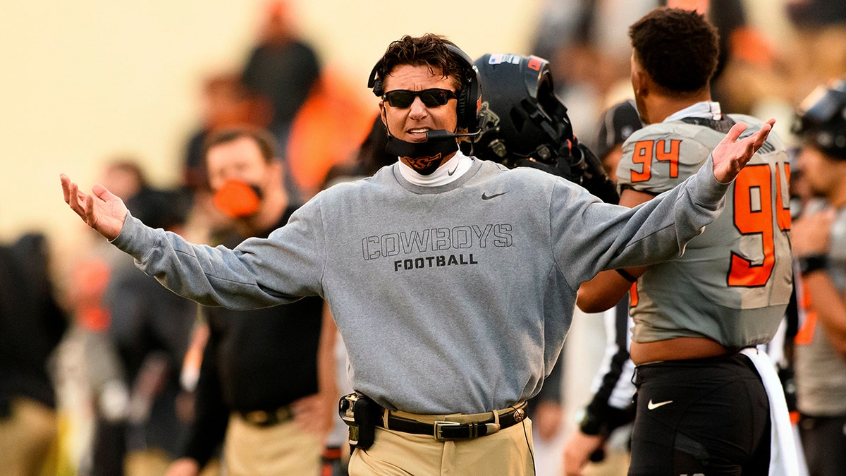 In this Saturday, Oct. 24, 2020, file photo, Oklahoma State head coach Mike Gundy gestures to an official during an NCAA college football game in Stillwater, Okla. The Sooners are the only Big 12 team without at least two losses even though none has played more than six games. (AP Photo/Brody Schmidt, File)