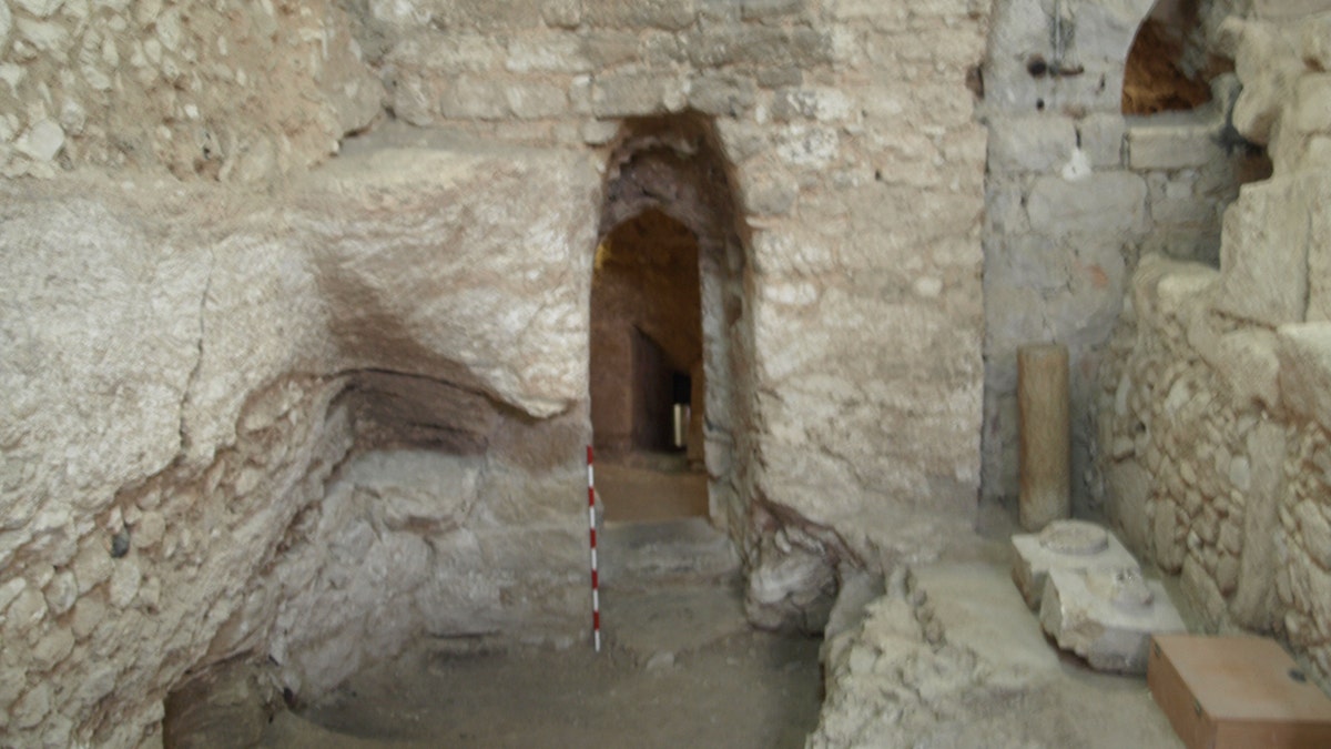 The first-century AD house showing the doorway and the only surviving section of the floor in front of it.
