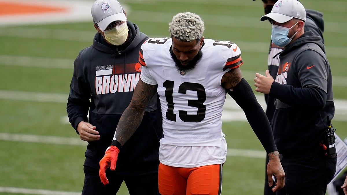 Former Cleveland Brown Odell Beckham Jr. (13) leaves the field after being injured during the first half against the Cincinnati Bengals, Sunday, Oct. 25, 2020, in Cincinnati.