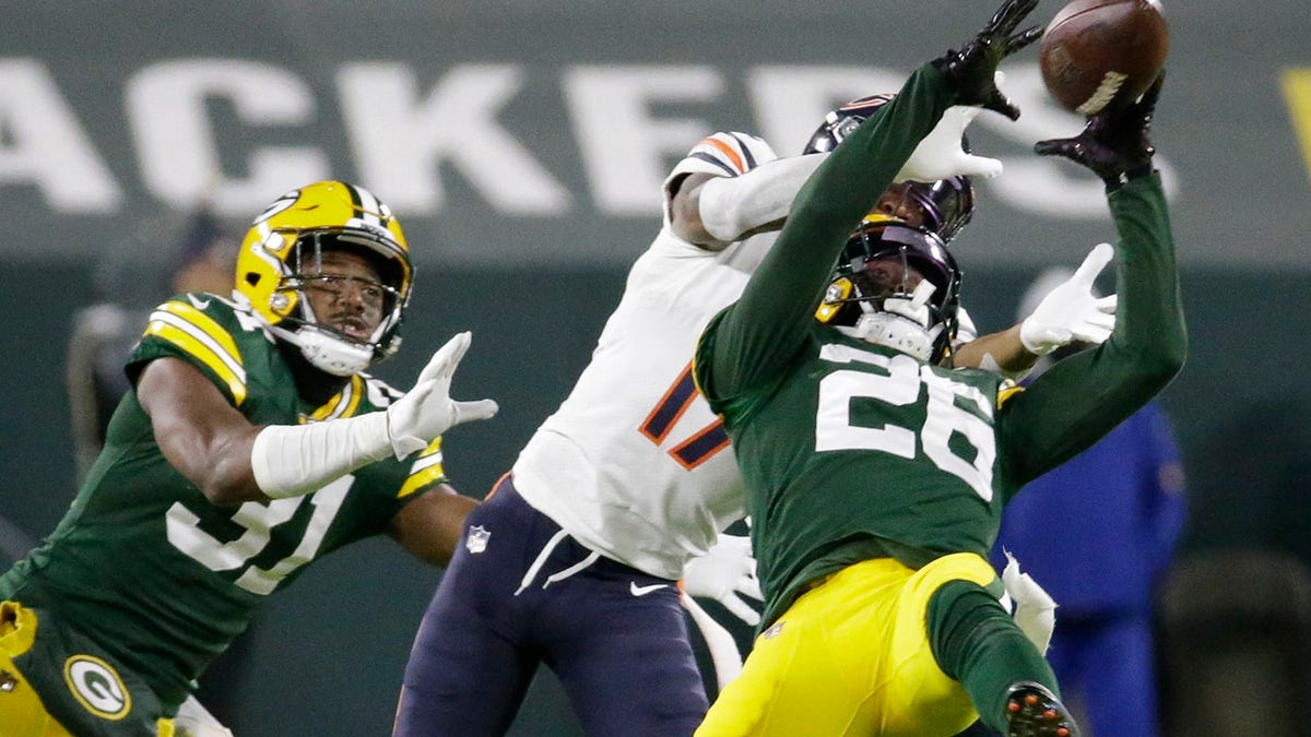 Green Bay Packers' Darnell Savage intercepts a pass in front of Chicago Bears' Anthony Miller during the second half of an NFL football game Sunday, Nov. 29, 2020, in Green Bay, Wis. (AP Photo/Mike Roemer)