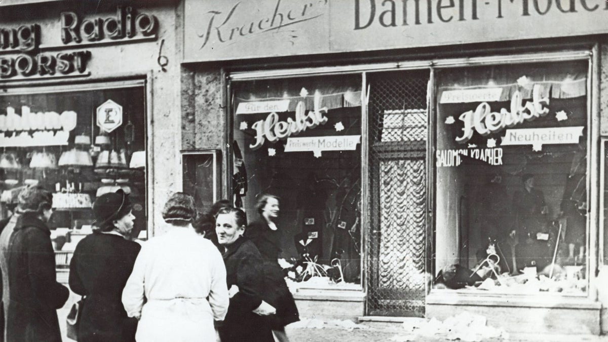 People stand outside a shop